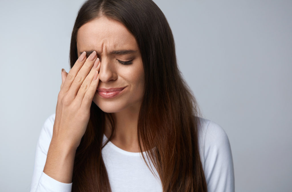 Women experiencing pain in eye which may require visit to optometrist