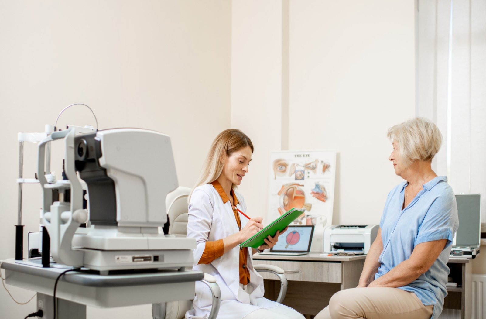 a senior woman speaks to her eye doctor in an optometrist office